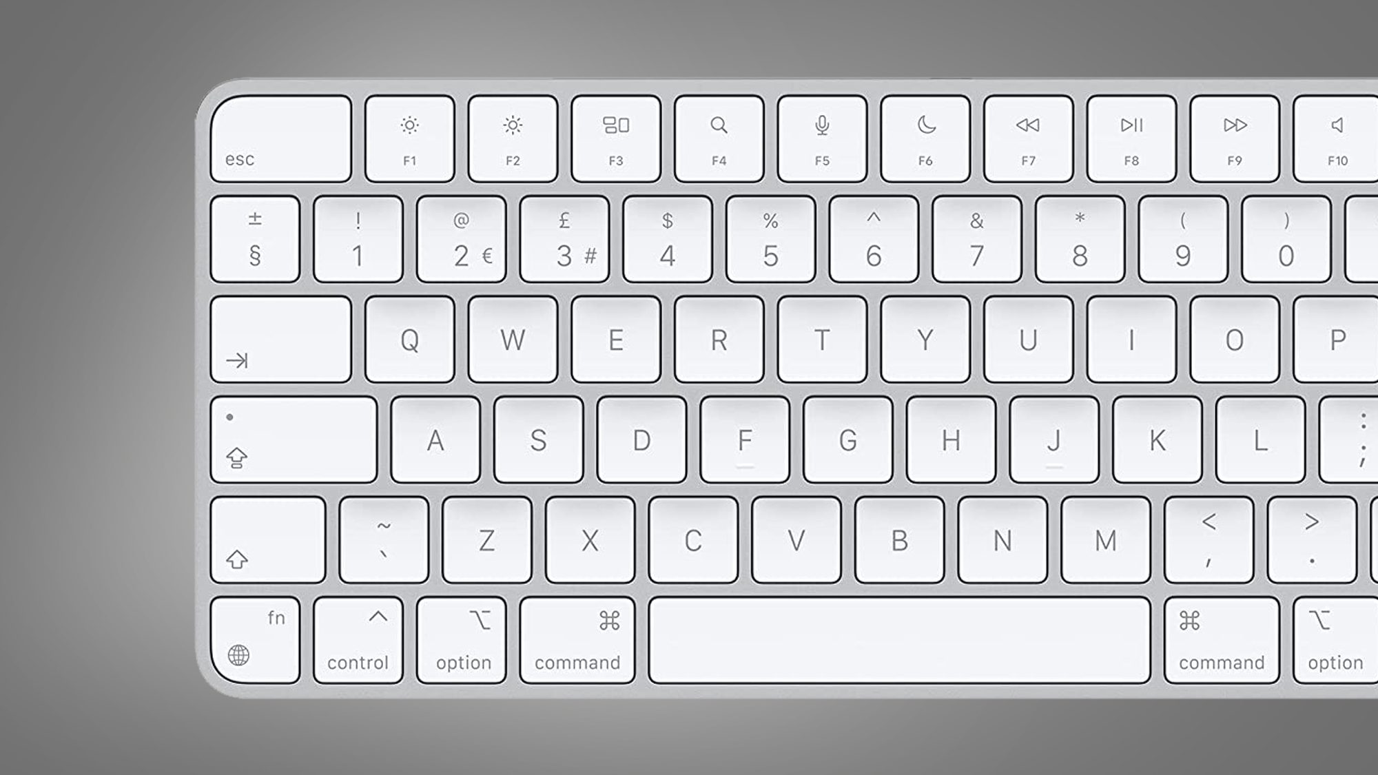 The Apple Magic Keyboard on a grey background