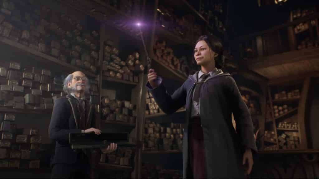 Postać Hogwarts Legacy trzymająca różdżkę